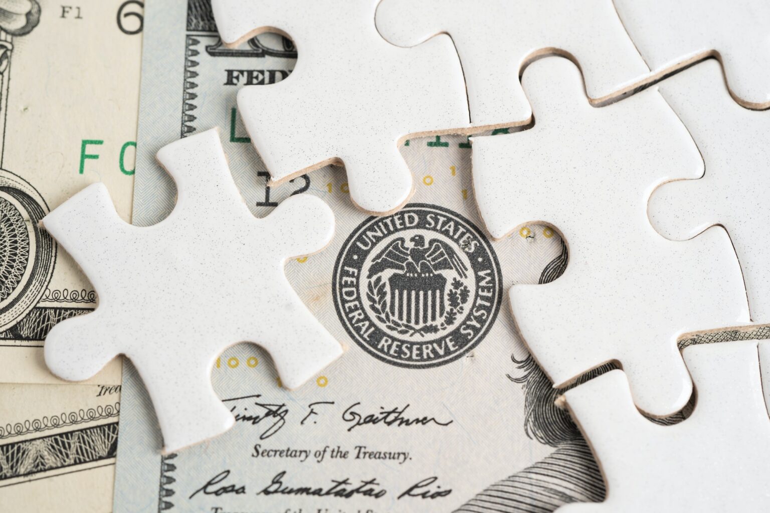 FED The Federal Reserve System with jigsaw puzzle paper, the central banking system.