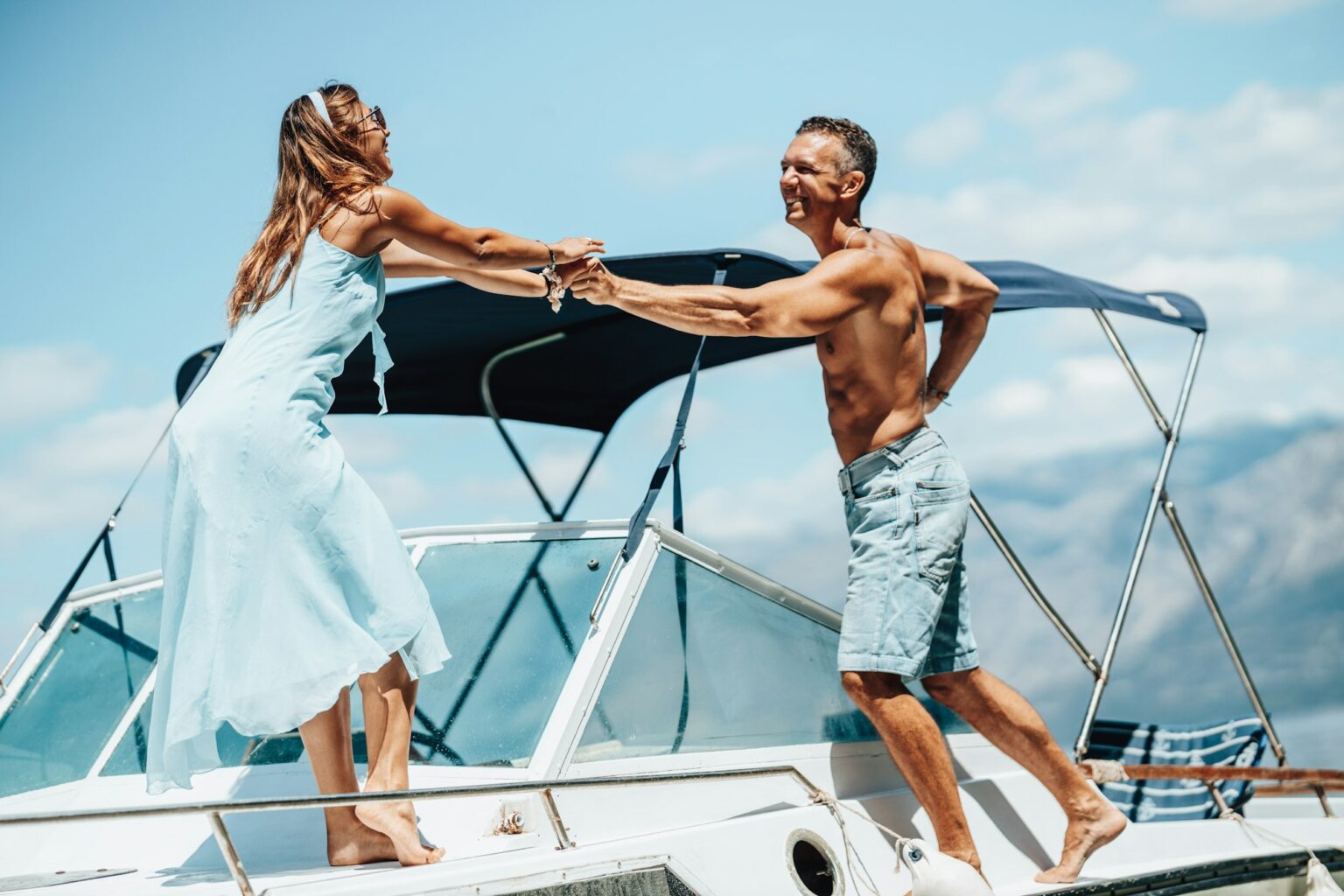 Couple Enjoying Day On Private Yacht